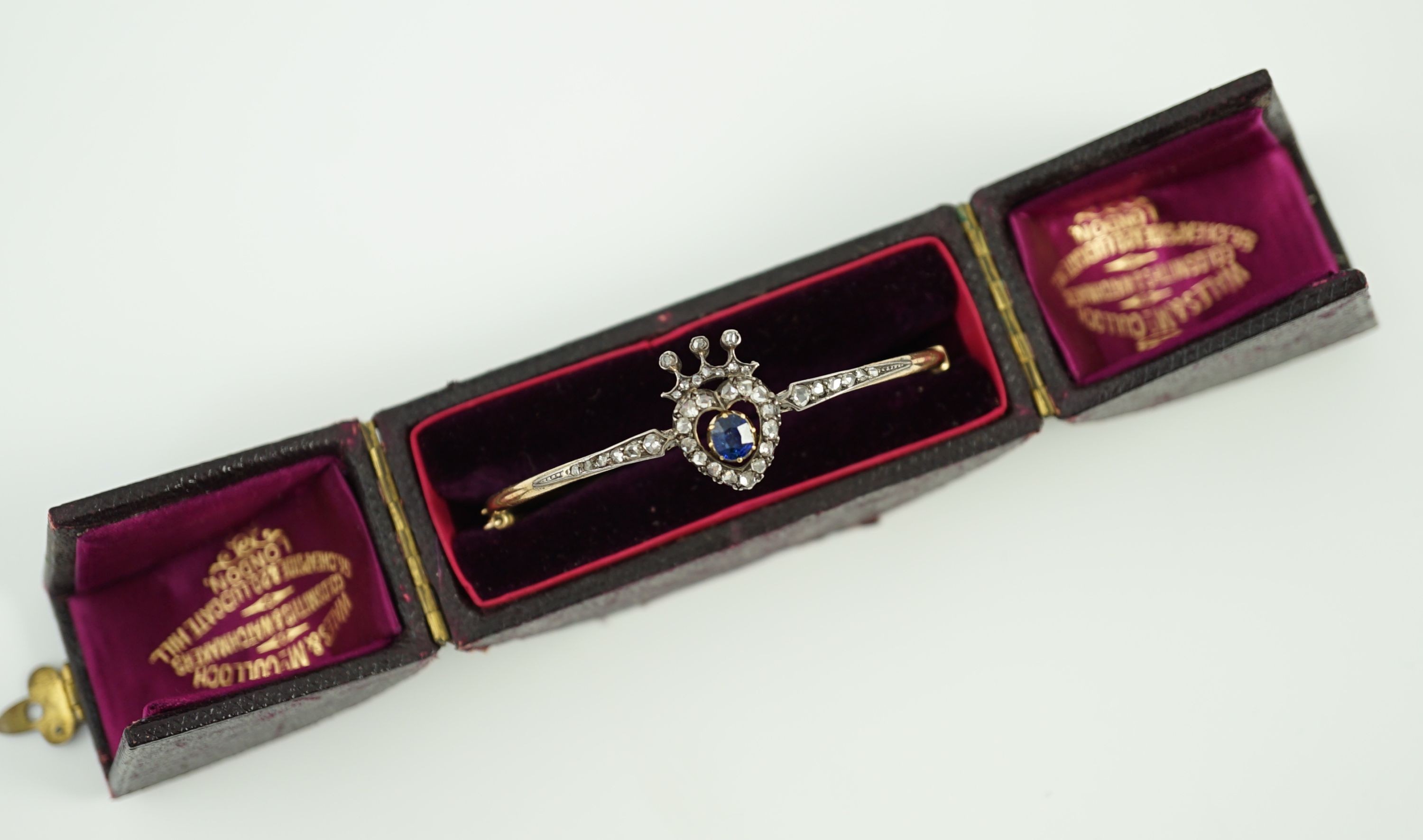 A 19th century gold, sapphire and rose cut diamond set hinged bangle